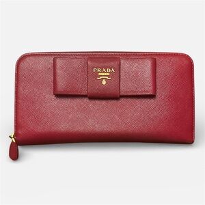 Authentic Prada Elegant Bow Wallet in dark pink/purple color.